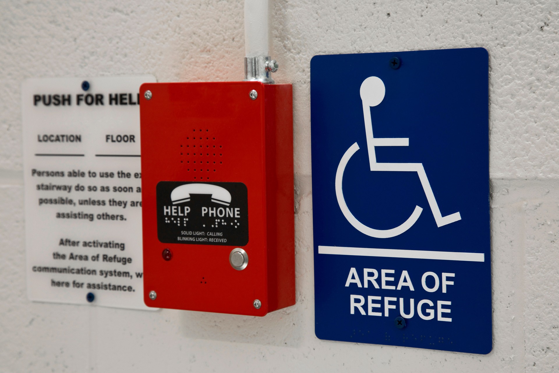 Area of refuge sign with help phone